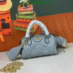 Grey Gucci small bag with elegant GG quilted leather and gold hardware.