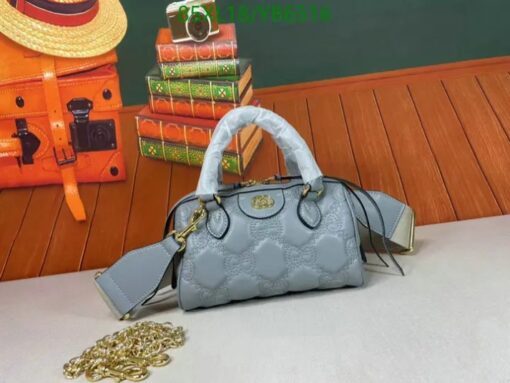 Grey Gucci small bag with elegant GG quilted leather and gold hardware.