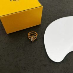 Fendi Asymmetrical Ring, featuring a unique asymmetrical design with a gold finish