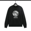 Sleek black Versace long sleeve sweatshirt made from soft cotton