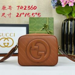 Brown Gucci crossbody handbag with quilted design and logo, green gift box, flowers, and product details.